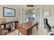 Bright home office featuring a large desk and built-in bookshelves at 3736 Bal Harbor Blvd, Punta Gorda, FL 33950