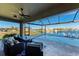 Screened pool and patio furniture with water view at 3736 Bal Harbor Blvd, Punta Gorda, FL 33950