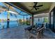 Relaxing screened lanai with water views and wicker furniture at 3736 Bal Harbor Blvd, Punta Gorda, FL 33950