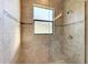 Clean shower with tile surround and a window at 3736 Bal Harbor Blvd, Punta Gorda, FL 33950