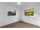 Bedroom showcasing hardwood flooring, natural light, and neutral walls at 5344 Swaying Palm Dr, Punta Gorda, FL 33982