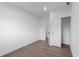 Minimalist bedroom with hardwood flooring, white walls, and closet at 5344 Swaying Palm Dr, Punta Gorda, FL 33982