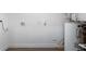 This utility room features white walls and is equipped with a water heater and electrical outlets at 5344 Swaying Palm Dr, Punta Gorda, FL 33982
