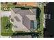 Bird's eye view of home, pool, and canal-side lot at 566 Port Bendres Dr, Punta Gorda, FL 33950