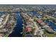 An aerial view of a waterfront home in a quiet community at 566 Port Bendres Dr, Punta Gorda, FL 33950
