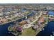 Aerial view of a waterfront home with private dock at 566 Port Bendres Dr, Punta Gorda, FL 33950