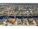 Aerial view of a waterfront home with a spacious lot at 566 Port Bendres Dr, Punta Gorda, FL 33950