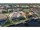 Aerial view showcasing a single-Gathering home, pool, and private dock at 566 Port Bendres Dr, Punta Gorda, FL 33950