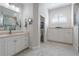 Bathroom featuring a large vanity, toilet, and walk-in shower at 566 Port Bendres Dr, Punta Gorda, FL 33950