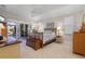 Main bedroom with a queen-size bed and access to the backyard at 566 Port Bendres Dr, Punta Gorda, FL 33950