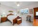 Spacious bedroom with wooden bed frame and large window at 566 Port Bendres Dr, Punta Gorda, FL 33950