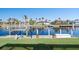 Private boat dock with canal access and lush landscaping at 566 Port Bendres Dr, Punta Gorda, FL 33950