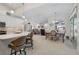 Modern kitchen with white cabinetry, quartz countertops, and breakfast bar at 566 Port Bendres Dr, Punta Gorda, FL 33950