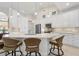 Updated kitchen featuring white cabinets, an island, and tile backsplash at 566 Port Bendres Dr, Punta Gorda, FL 33950