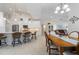 Modern kitchen with white cabinets, breakfast bar, and stainless steel appliances at 566 Port Bendres Dr, Punta Gorda, FL 33950