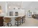 Modern kitchen with white cabinets, breakfast bar, and stainless steel appliances at 566 Port Bendres Dr, Punta Gorda, FL 33950