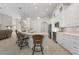 Modern kitchen with white cabinets, breakfast bar, and stainless steel appliances at 566 Port Bendres Dr, Punta Gorda, FL 33950