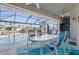 Relaxing poolside patio with seating area, overlooking the canal at 566 Port Bendres Dr, Punta Gorda, FL 33950