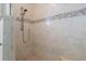 Large walk-in shower with tiled walls and a built-in seat at 566 Port Bendres Dr, Punta Gorda, FL 33950