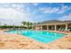 Resort-style pool with lounge chairs and cabanas at 7177 W Lenox Cir, Punta Gorda, FL 33950