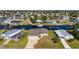 Stunning aerial view of canal-front home and neighborhood at 740 Kingfish Ct, Punta Gorda, FL 33950