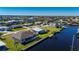 Aerial view of a canal-front home with a private dock at 740 Kingfish Ct, Punta Gorda, FL 33950