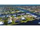 Aerial view highlighting a waterfront home and its surroundings at 740 Kingfish Ct, Punta Gorda, FL 33950