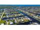 Aerial view of a canal-front house with a spacious backyard at 740 Kingfish Ct, Punta Gorda, FL 33950