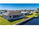 Aerial showcasing a waterfront home with a screened lanai at 740 Kingfish Ct, Punta Gorda, FL 33950