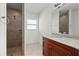 Bathroom with walk-in shower and granite vanity at 740 Kingfish Ct, Punta Gorda, FL 33950