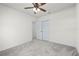 Bright bedroom with ceiling fan and access to another room at 740 Kingfish Ct, Punta Gorda, FL 33950