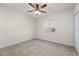 Well-lit bedroom featuring a ceiling fan and window at 740 Kingfish Ct, Punta Gorda, FL 33950