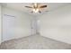 Large bedroom with ceiling fan and door to another room at 740 Kingfish Ct, Punta Gorda, FL 33950