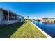 Beautiful canal front property with lush landscaping at 740 Kingfish Ct, Punta Gorda, FL 33950