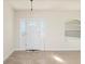 Bright and airy entryway with tiled floor and white door at 740 Kingfish Ct, Punta Gorda, FL 33950
