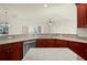 Spacious kitchen with stainless steel appliances and granite countertops at 740 Kingfish Ct, Punta Gorda, FL 33950