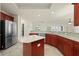 Kitchen with granite countertops, wood cabinets and island at 740 Kingfish Ct, Punta Gorda, FL 33950