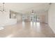 Spacious living room with tile floors and sliding doors to patio at 740 Kingfish Ct, Punta Gorda, FL 33950