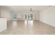 Spacious living room with tile floors and sliding doors to patio at 740 Kingfish Ct, Punta Gorda, FL 33950