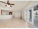 Open living space with tile floors, access to a pool, and an open floor plan at 740 Kingfish Ct, Punta Gorda, FL 33950