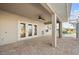 Covered patio with canal view and access to interior at 740 Kingfish Ct, Punta Gorda, FL 33950