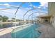 Relaxing screened pool and spa with canal views at 740 Kingfish Ct, Punta Gorda, FL 33950