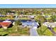 Aerial view of house, showcasing canal-front location and metal roof at 824 E 6Th St, Englewood, FL 34223