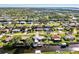 Aerial view of a canal-front house and neighborhood at 824 E 6Th St, Englewood, FL 34223