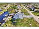 Aerial view of the house, highlighting its metal roof and canal location at 824 E 6Th St, Englewood, FL 34223