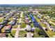 Aerial view showcasing home's location on canal, near other houses at 824 E 6Th St, Englewood, FL 34223