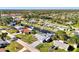 Aerial view of canal-front home with metal roof and spacious yard at 824 E 6Th St, Englewood, FL 34223