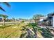 Landscaped backyard with canal view and privacy at 824 E 6Th St, Englewood, FL 34223