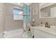 Clean bathroom with updated vanity and shower/tub combo at 824 E 6Th St, Englewood, FL 34223