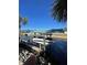 Covered boat lift with dock access on a canal at 824 E 6Th St, Englewood, FL 34223
